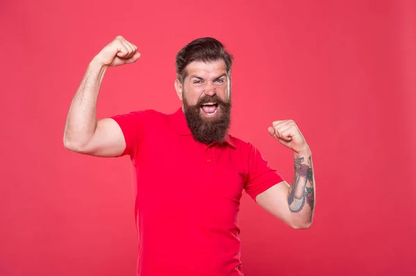 Who is cool. Strong hipster muscular arms red background. Physical strength. Strong biceps and triceps. Strong muscle workout. Power and strength. Believe in yourself. Fitness instructor. Work at gym