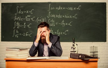 Teaching dumb students. No hope for better. Tired and exhausted. Teacher mature man. Fed up. Difficult work. Emotional burnout. Teacher give up. Hate his job. Man desperate teacher in classroom clipart