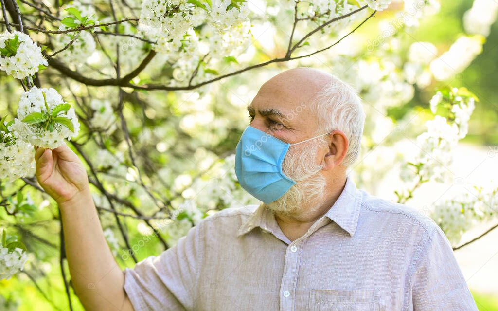 Asthma concept. Respiratory condition. Difficulty in breathing. Allergic reaction or form of hypersensitivity. Pandemic concept. Limit risk infection spreading. Senior man face mask. Respiratory mask