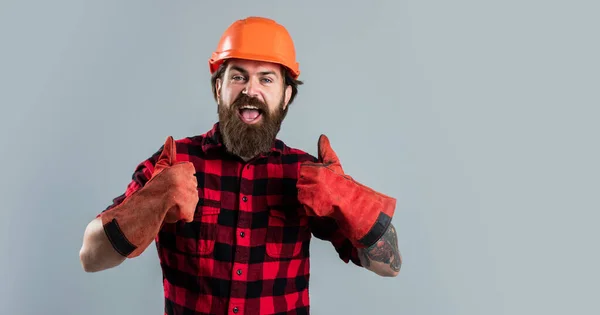 Thumb up for success. successful male worker wear hard hat. brutal builder in helmet. bearded repairman. confident construction engineer. professional architect. repair and building. work gloves — Stock Photo, Image