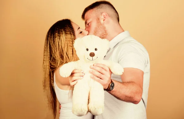 Soft toy teddy bear gift. Pregnancy concept. Man and woman couple in love. Future parents. Family love. Man and pretty girl in love. Guy and girl cuddling. Happy family. Valentines day holiday — Stock Photo, Image