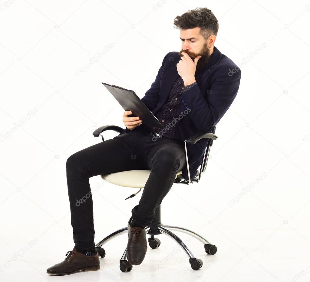 Bored man in formal suit sitting on office chair