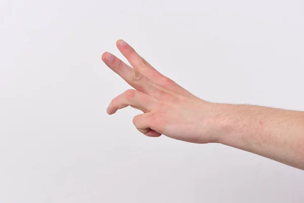 La mano masculina muestra dos dedos y medio. Cuenta atrás —  Fotos de Stock
