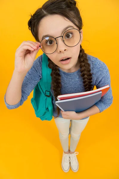 Always look smart and beautiful. Smart look of schoolchild. Little schoolgirl wear eyeglasses. Small child back to school. School look. Fashion and beauty. Dedicated to learning