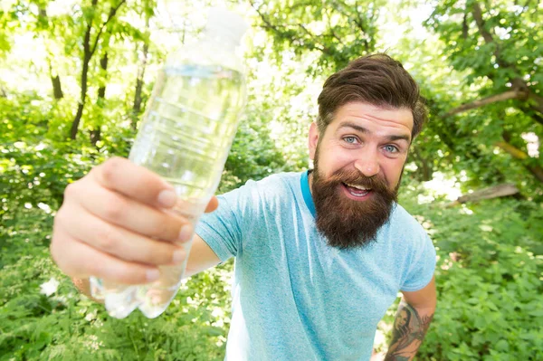 Fix It All With H2O. brutal caucasian hipster with moustache. Bearded man drink water. ready for camping. male happy tourist feel thirsty. sport and fitness clothes. Confident and handsome brutal man