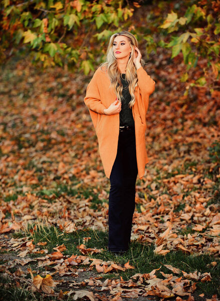 Woman walk sunset light. Clothing for every day. Girl adorable blonde posing in warm and cozy outfit autumn nature background defocused. Cozy casual outfits for fall. Cozy outfit ideas for weekend