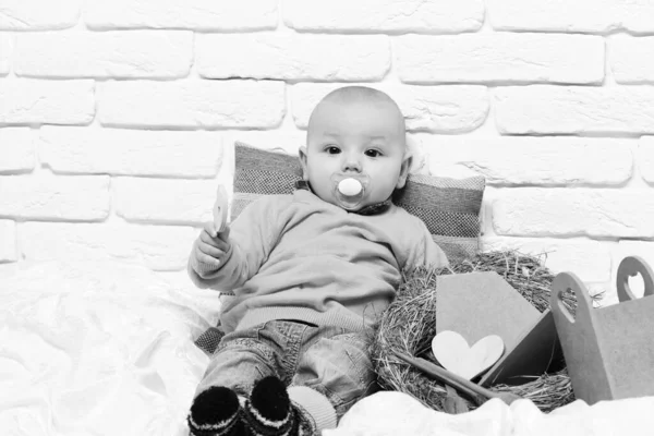 Small baby boy kid on white brick wall background — Stock Photo, Image