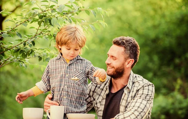 Nutrition kids and adults. Little boy and dad eat. Everything is more fun with father. Organic nutrition. Healthy nutrition concept. Nutrition habits. Kid hold spoon. Family enjoy homemade meal — Stock Photo, Image