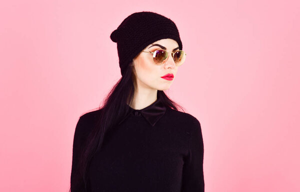 Closeup studio shot of beautiful hipster fashionable teenage girl wearing black clothes
