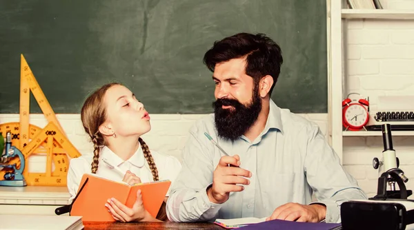 Fascinating lesson. School teacher and schoolgirl. Pedagogue skills. Talented pedagogue. Work together to accomplish more. Explaining science to child. Man bearded teacher excellent pedagogue — Stock Photo, Image