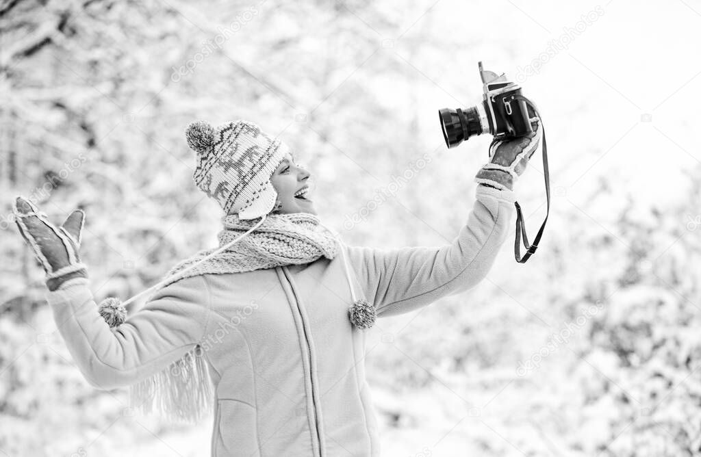 ready for weather forecast. expedition. winter girl with vintage camera. happy woman make selfie on camera. winter selfie. having fun outdoor snowy forest. cold weather brings good mood