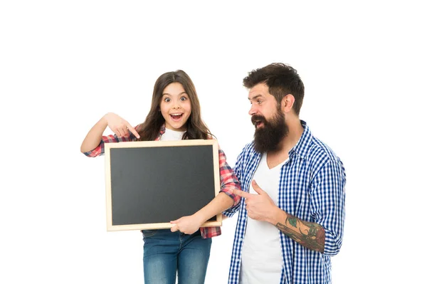 Family news. Sale and discount. We love it. Girl with dad on white background. International childrens day. Happy childhood. Advertising or promotion. Father and daughter hold chalkboard copy space — Stock Photo, Image