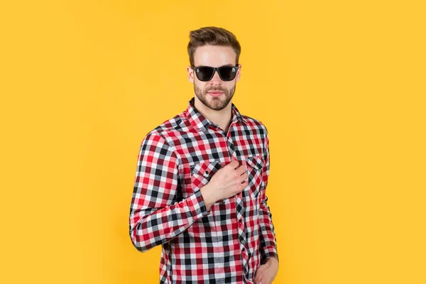 Confident in his choice. handsome confident young man standing in shirt and glasses. sexy guy looking. portrait of fashionable handsome man in shirt. business classic mens shirts with checkered print — Stock Photo, Image