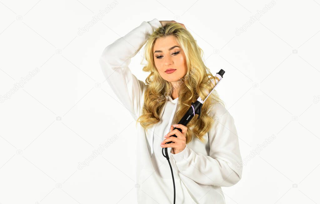 Woman with long curly hair use curling iron. Hairdresser equipment. Heat setting for hair type. Girl adorable blonde hold curling iron white background. Ceramic coating that minimizes harm