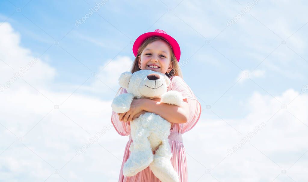 Excitement. teddy bear shop. toy shop for kids. happy childrens day. childhood happiness. little cheerful child with present. fluffy and cute gift. happy birthday. small girl play with bear toy