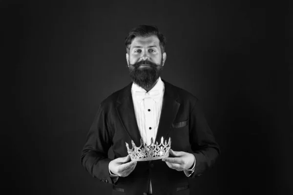 Now come and make it worth. Crown in hands. Handsome man give crown black background. Getting reward. Crowning glory. Glory and ambitions. King crown. Royal coronation symbol. Reputation and status — Stock Photo, Image