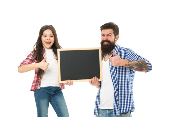 Awesome news. Small girl with dad on white background. Happy childhood. Advertising or promotion. Father and daughter hold chalkboard copy space. Fathers day. International childrens day. Family news — Stock Photo, Image