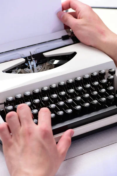 Writer typing with retro writing machine. Typography and writing