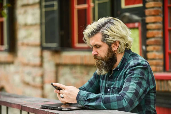 online distant education. hipster inspired to work. agile business. mature student working on computer. go shopping on cyber monday. bearded man in cafe with laptop and phone. Ready to study