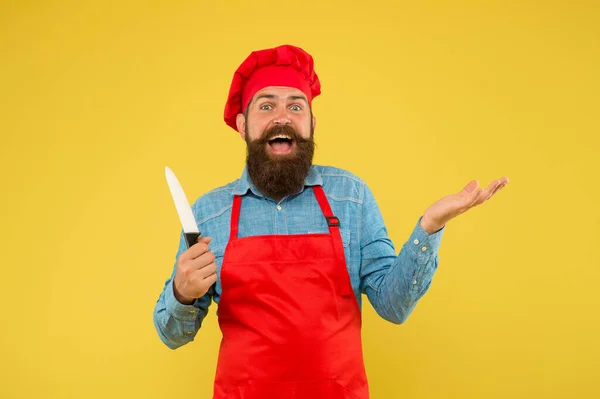 Food with passion. special offer from chef. chef in restaurant kitchen. mature male chef on yellow backdrop. happy man cooking on kitchen. Professional chef man with knife. excellent cook or baker — Stock Photo, Image