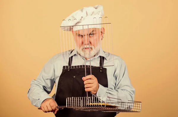 Lunch time. cook men with beard. cooking utensils for barbecue. he prefer grill food. Picnic and barbecue. Kitchen rules. prepare dinner for family. Family weekend. senior man in chef hat