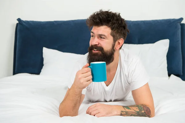 stock image Man happy bearded face drink morning coffee relax in bedroom, perfect awakening concept