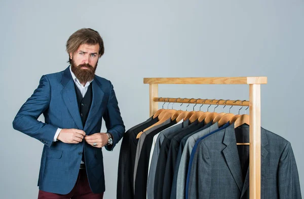 Designing new clothes. Individual measures hand of man. Man ordering business suit posing indoor. Tailor measures man. stylish business man at workspace. Fashion design studio. Male fashion designer — Stock Photo, Image