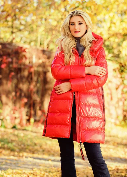 Feel cozy and warm this autumn. Autumn season fashion. Girl enjoy autumn walk. Clothing for autumn walk. Woman wear coat or warm jacket while walk in park nature background. Must have fall wardrobe