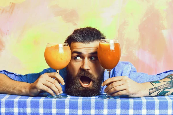 Brutal caucasian hipster with moustache between tropical alcoholic fresh cocktails — Stock Photo, Image