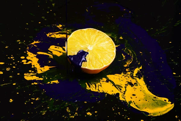 Nutrition and food art. Drops of blue and yellow paint