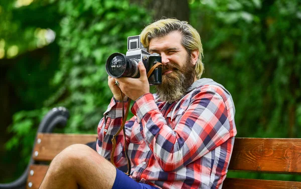 Find perfect angle. Man with retro camera. Photography in modern life. Photographer use vintage camera. Bearded man hipster taking photo. Hobby and professional occupation. Camera settings concept — Stock Photo, Image