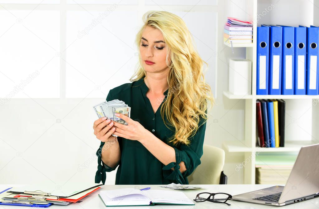 Strict money accounting. Financial crisis. Accountant learn indicators markers. Lack of income. How to increase income. Owner of small business. Girl in office analyzing financial report. Low income