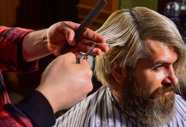 Guy with dyed hair. Barber hairstyle barbershop. Hipster getting haircut. Professional cosmetics. Scissors cutting. Short hair is not always less work than long hair. Donation and charity concept