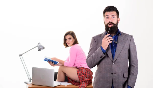 Sexy lady office worker. Sexy personal secretary. Full of desire. Office collective concept. Bearded boss stand in front of sexy girl working laptop. Sexual provocation. Office manager or secretary