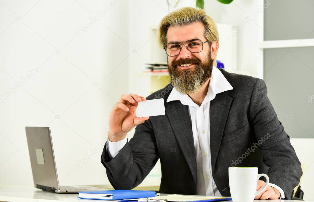 So happy. my business card. Business-minded businessman. bearded man in jacket with laptop. boss in workplace. modern office life. distant work while coronavirus quarantine. mature school teacher
