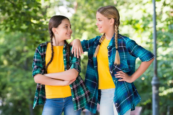 Casual kid fashion. happy childrens day. funny time spending. cheerful girls best friends. Wearing denim clothes. girls teenagers spend time having fun. Childhood lifestyle concept. togetherness — Stock Photo, Image