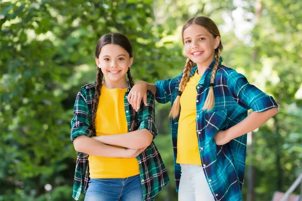 We are one. kid casual fashion. childhood happiness. happy childrens day. spend time and have fun together. best school friends. concept of friendship. small happy girls wear checkered shirt — Stock Photo, Image