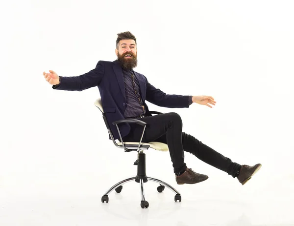 Businessman having fun. Cheerful businessman sitting on the office chair — Stock Photo, Image