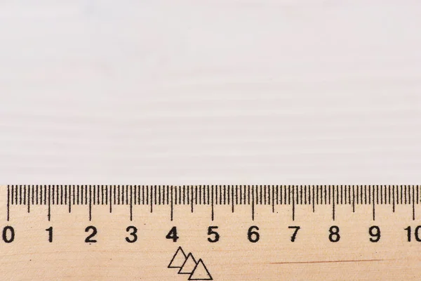 Wooden ruler close up on white background. — Stock Photo, Image