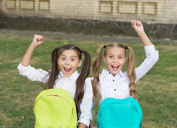 Cute classmates girls with backpacks, happy childhood concept — Stock Photo, Image