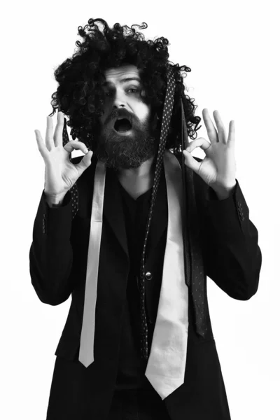 Caucasian hipster in suit and black curly wig — Stock Photo, Image