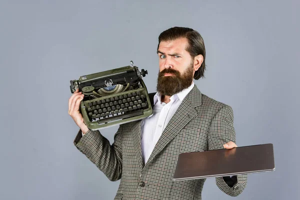 what to choose. mature man hold vintage device. first draft. professional typist make notes. modern and old technology. digital business. successful businessman use retro typewriter and computer