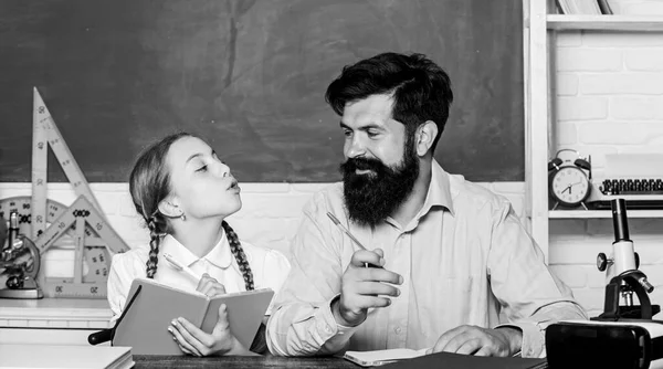 Fascinating lesson. School teacher and schoolgirl. Pedagogue skills. Talented pedagogue. Work together to accomplish more. Explaining science to child. Man bearded teacher excellent pedagogue — Stock Photo, Image