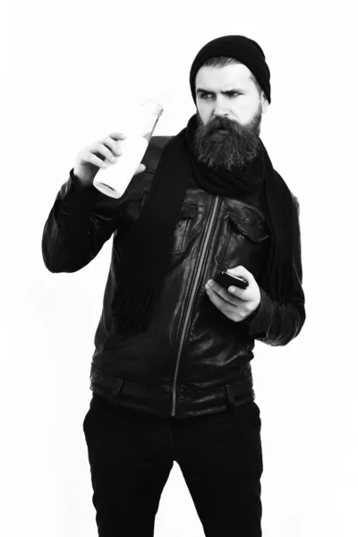 Bearded brutal caucasian hipster holding glass jar of milk — Stock Photo, Image