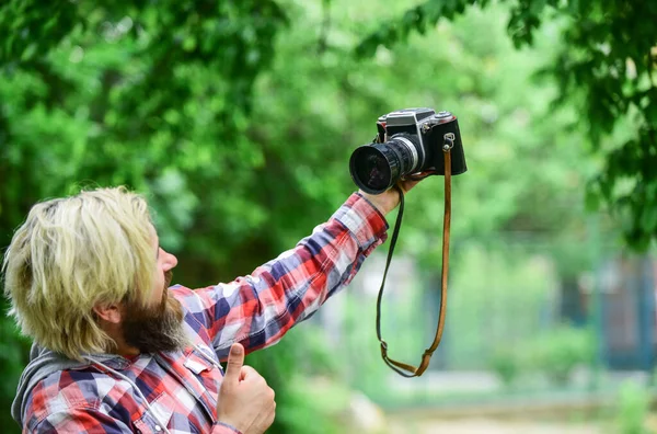 Photography in modern life. Use camera. Creating content for blog. Photographer and vintage camera. Man with retro camera. Bearded man hipster taking photo. Hobby and professional occupation — Stock Photo, Image