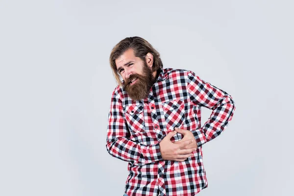 Looking very bad. bearded man wear checkered shirt. brutal man feeling pain. male health care. pain in heart. mature hipster with beard has heartache. brutal caucasian guy with moustache — Stock Photo, Image