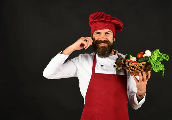 Man with beard on black background. Healthy cooking concept.