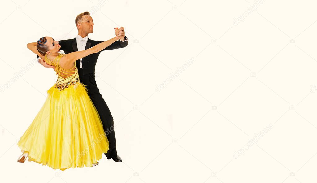 ballrom dance couple in a dance pose isolated on black background
