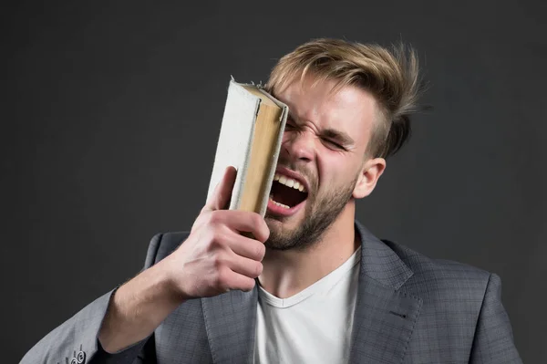 Man beat face with book, motivation