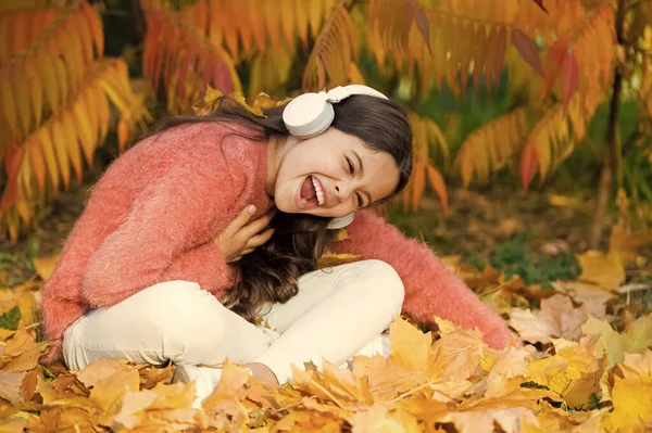 Special instrumental music collection for total relax. Kid girl relaxing near autumn tree with headphones. Music for pleasant cozy mood. Enjoy music outdoors fall warm day. Autumn is finally here